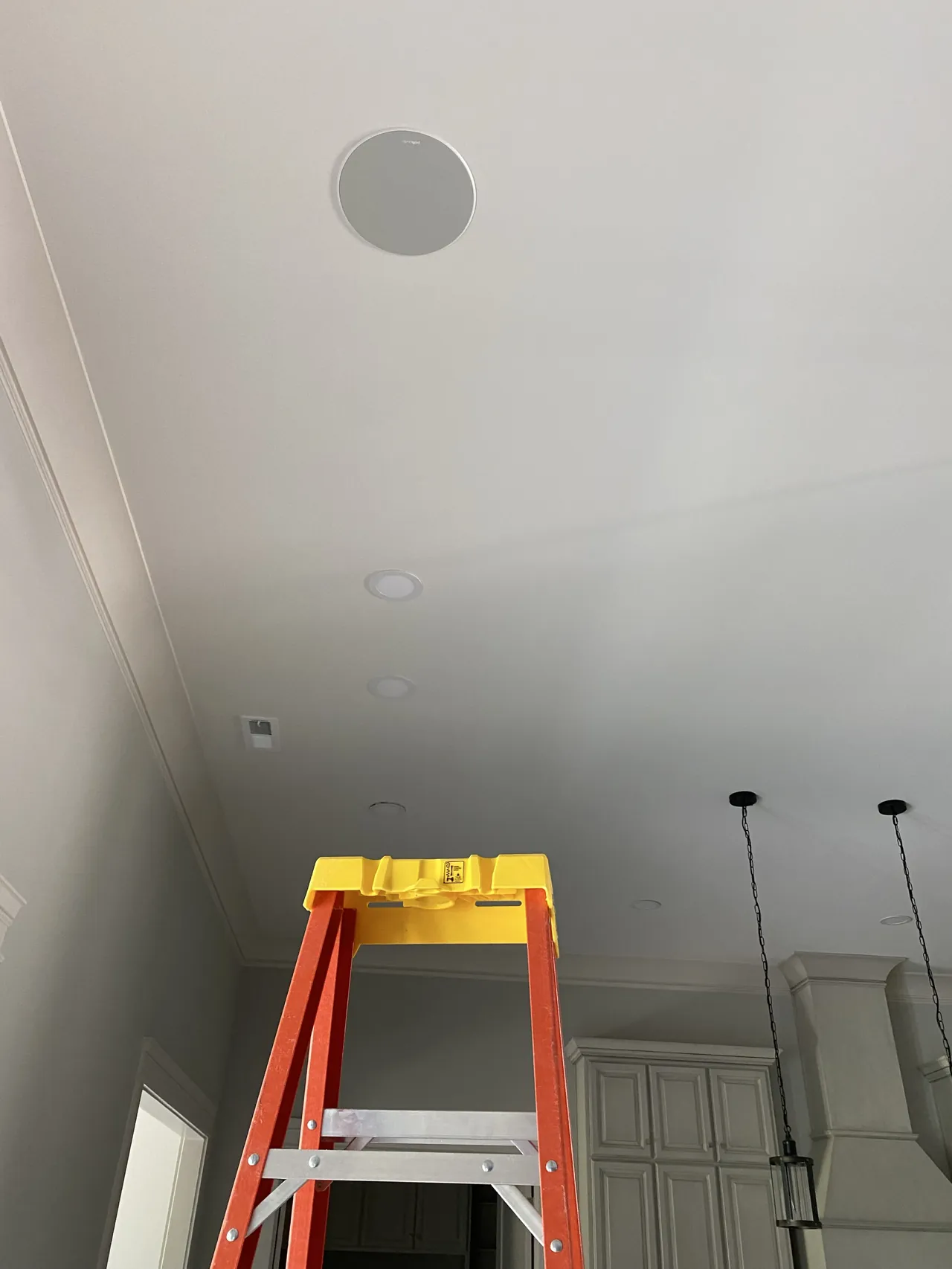 In-ceiling speakers installed with recessed lighting - precise, flush finish.