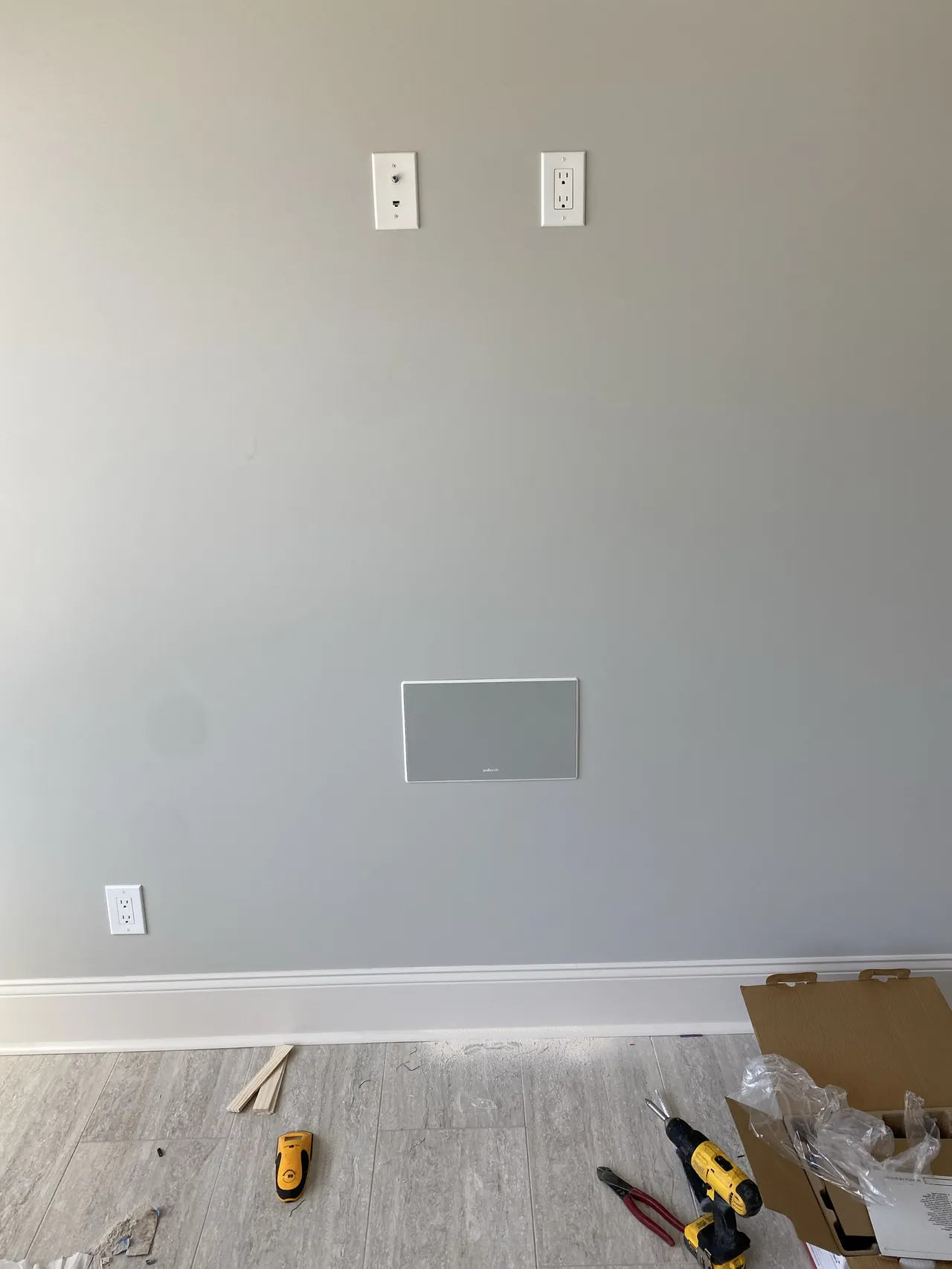 In-wall speaker installation, concealed wiring for a clean modern look.