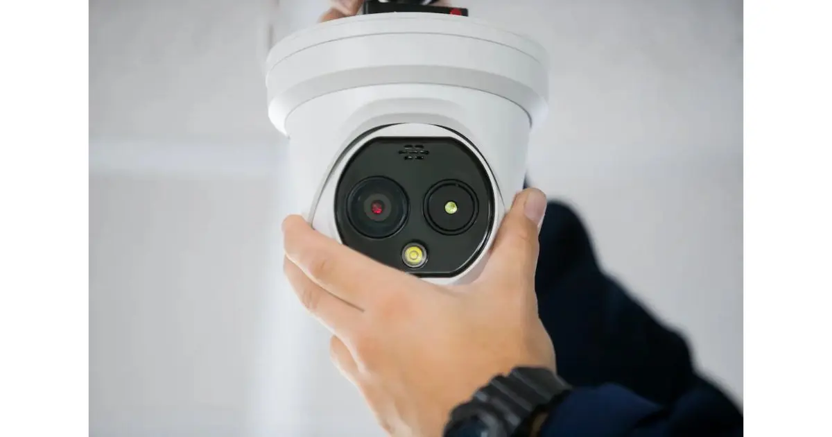 Outdoor security camera on brick exterior